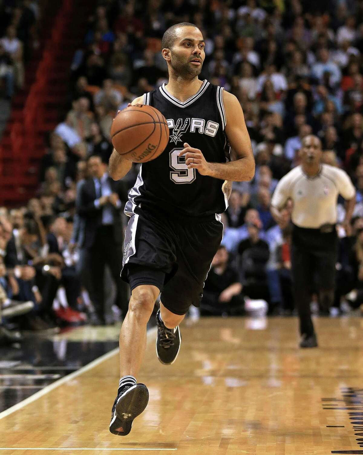 MIAMI, FL - FEBRUARY 09: Tony Parker #9 of the San Antonio Spurs drives during a game against the Miami Heat at American Airlines Arena on February 9, 2016 in Miami, Florida. NOTE TO USER: User expressly acknowledges and agrees that, by downloading and/or using this photograph, user is consenting to the terms and conditions of the Getty Images License Agreement. Mandatory copyright notice: