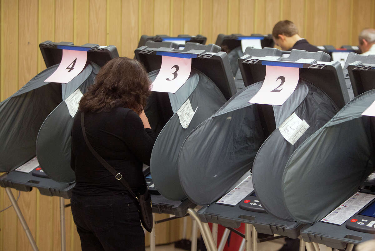 Voters casting ballots. (Cody Duty / Houston Chronicle)
