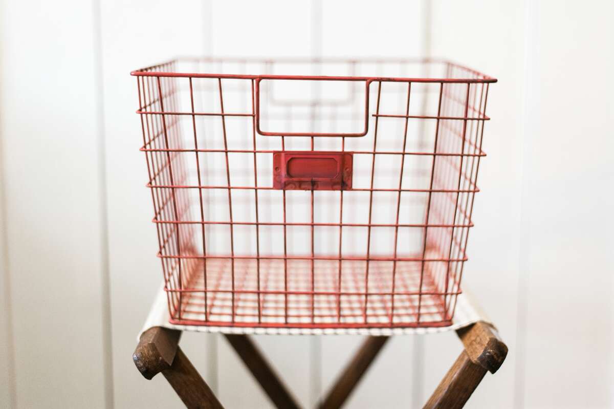 When you're looking for accessories, think about function, Joanna Gaines of "Fixer Upper" says. "You can find pieces that are unique but also functional. . . . Everything in my house is taking up square footage, so it better be practical." The red Locker Basket, for example, from Gaines' own Magnolia Market, can become a colorful shoe drop ($21, magnoliamarket.com). MUST CREDIT: Magnolia Market.