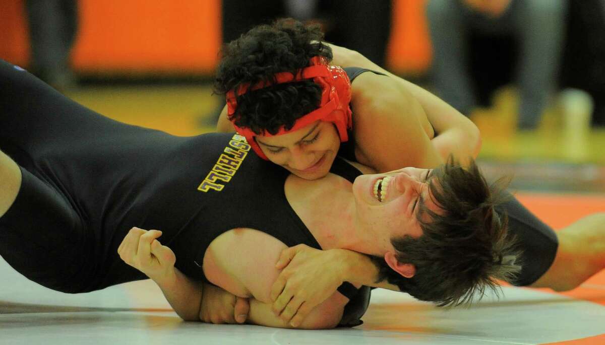 Stamford's Garey Mendez pins Westhill's Rodrigo Foley for the win at 2minutes 50 seconds during the 126 pound match of a FCIAC league dual meet at Stamford High School on Feb. 10, 2016. Westhill defeated Stamford 42-28 to win the Stamford city championship.