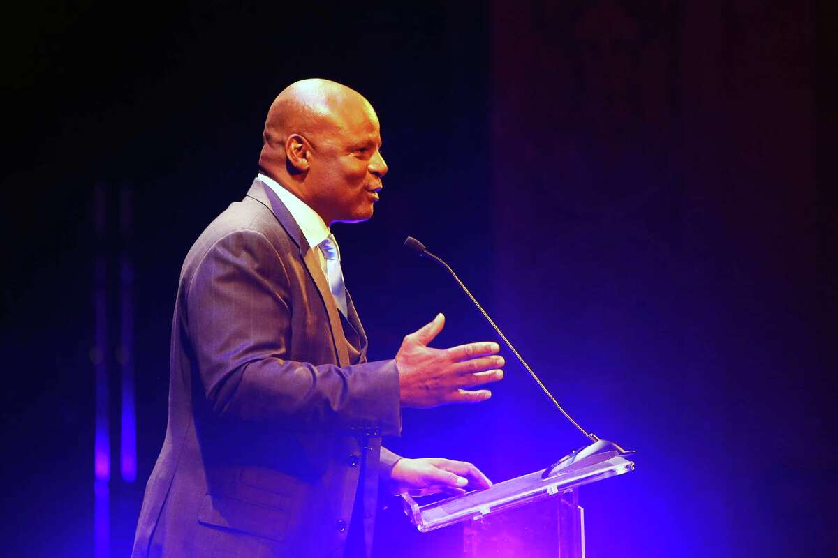 The first African-American quarterback to enter the Hall of Fame and nine-time Pro Bowl selection Warren Moon accepts the Royal Brougham Award for a lifetime of achievement during the 2016 MTRWestern Sport Star of the Year Awards, Wednesday, Feb. 10, 2016 at the Paramount Theater. An executive assistant to Moon filed a lawsuit Monday, alleging him of sexual harassment and assault, according to The Washington Post.