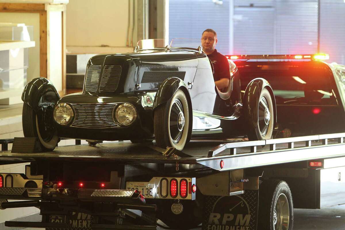 Ford Motor Company Greg Stoner (behind wheel) in the Edsel Ford's personal Model 40 Special Speedster in to a dock at the Museum of Fine Arts, Houston Thursday, Feb. 11, 2016, in Houston. The MFAH is getting 17 Art Deco cars and motorcycles into the museum for its "Sculpted in Steel" exhibition.