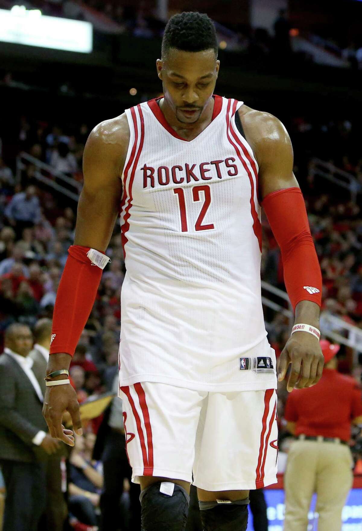 Houston Rockets center Dwight Howard (12) leaves the court after being called for a second technical foul during a game against the Washington Wizards in the fourth quarter at the Toyota Center Saturday, Jan. 30, 2016, in Houston, Texas. Howard was ejected from the game along with Washington Wizards center Nene Hilario (42). Rockets lost 122-123. ( Gary Coronado / Houston Chronicle )