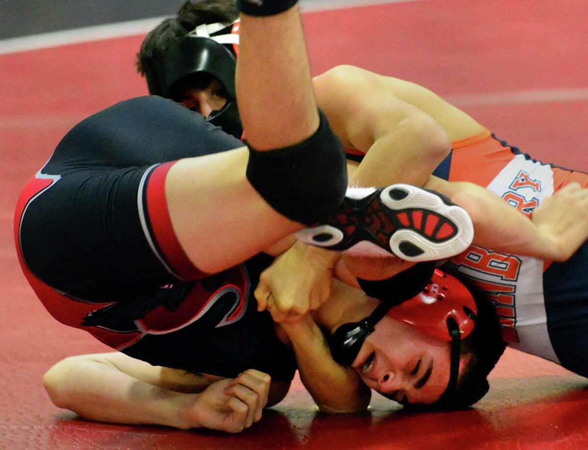 Fairfield Warde's Luke Bender is put into a cradle hold just before being pinned by Danbury's Jakob Camacho during wrestling tournament action in Fairfield, Conn. on Wednesday Jan. 27, 2016.