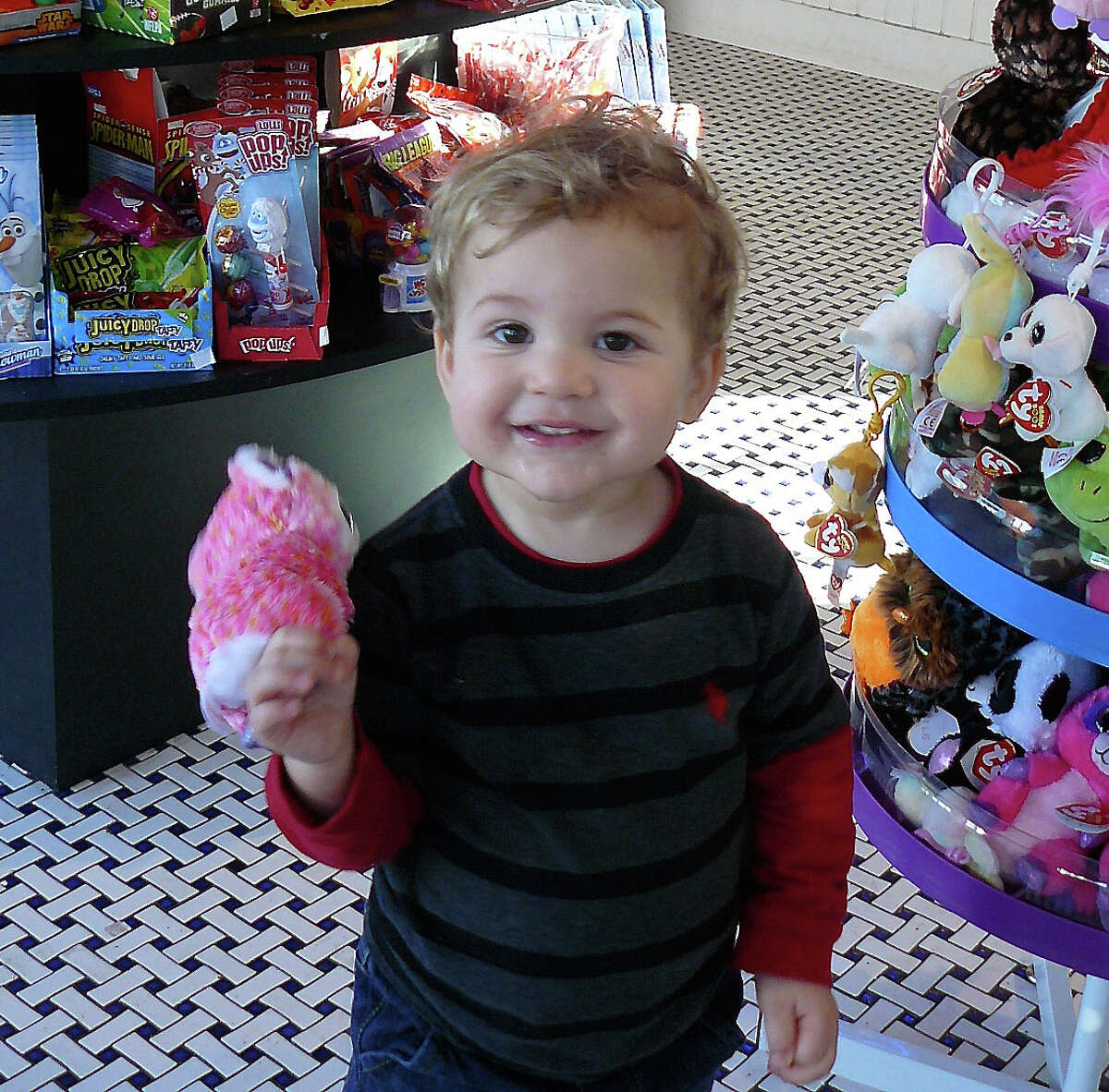 Two-year-old Bennett Gotfried of Fairfield chose a toy over ice cream during a recent visit to the Saugatuck Sweets shop in Westport.
