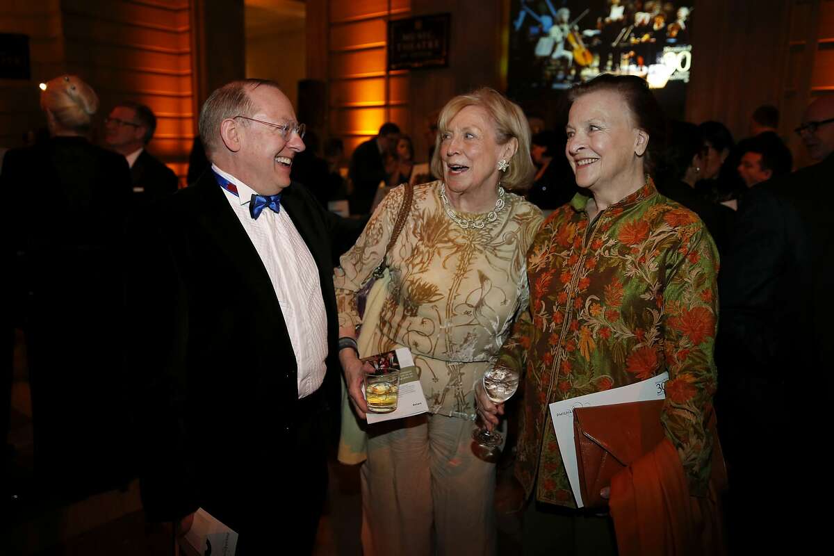Nicholas McGegan (left), Marie Collins and Blanche Streeter chat during a gala celebrating the 30th anniversary of the Philharmonia Baroque Orchestra's music director McGegan at San Francisco City Hall on Thursday, Feb. 11, 2016.