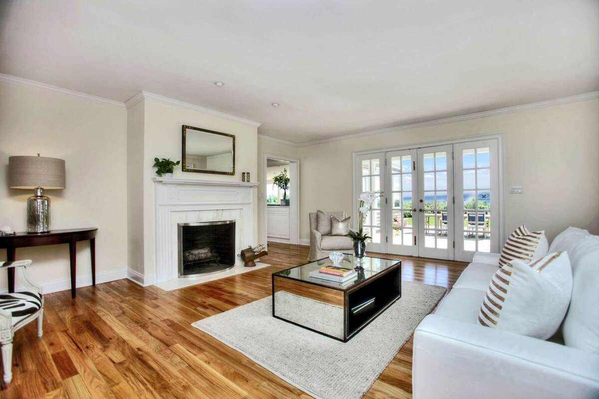 The formal living room, like many of the home's rooms, has a sweeping water view.
