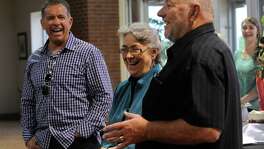 Ronald W. Erdrich/Reporter-News
Farris Wilks, right and his brother Dan laugh with their sister Beth Maynard while telling a story about her time working for their company, Tuesday evening, April 23, 2013. Maynard started working for her brothers in 1978 and retired this week.
