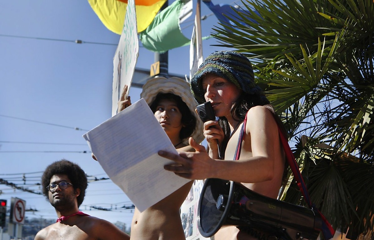 Gypsy Taub, right, speaks to participants and on-lookers about the San Francisco Nudity Ban along with her daughter Inti Gonzalez, center, and Gameli Anumu, left, during the first annual Valentine's Nude Parade put together by the Body Freedom Network, in San Francisco, Calif., in this file photo from Feb. 13, 2016.