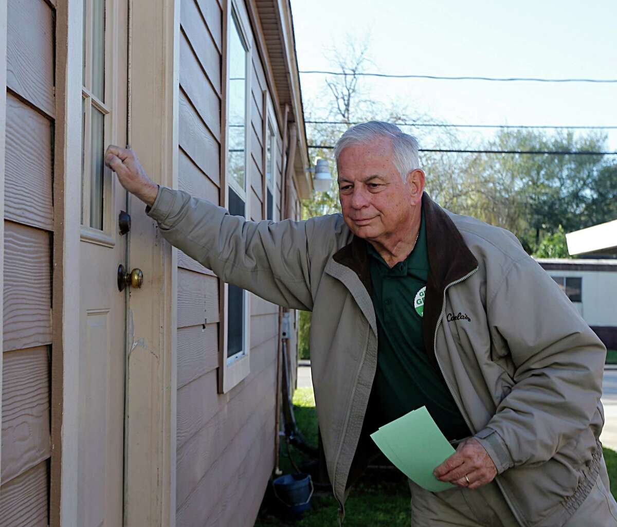 Congressman Gene Green knocks on a door while canvasing voters at their homes Saturday, Jan. 9, 2016, in Pasadena. ( James Nielsen / Houston Chronicle )