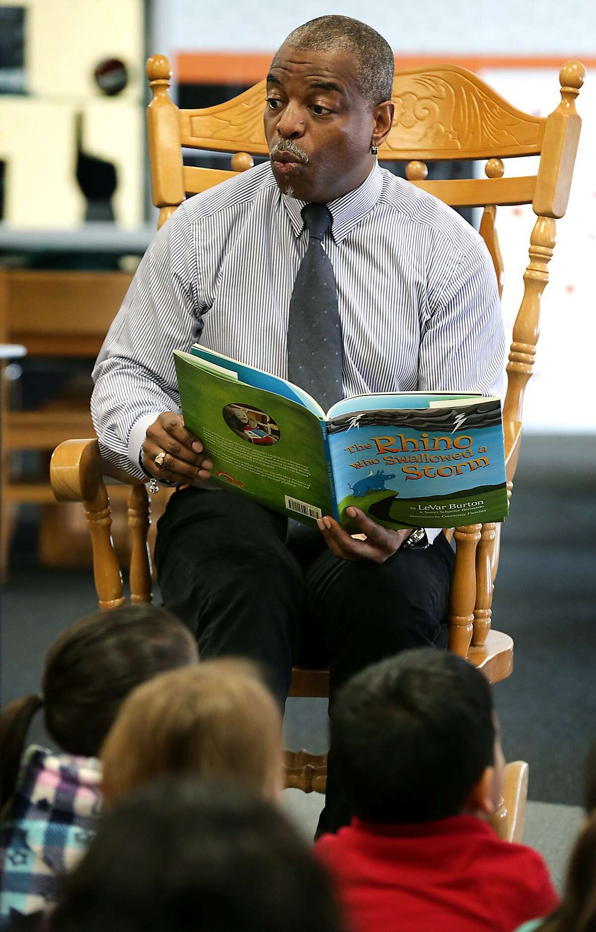 LeVar Burton, host of "Reading Rainbow" and actor in "Roots" and "Star Trek", reads his children's book "The Rhino Who Swallowed A Storm" to students at Bowden Elementary School on Thursday, Feb. 11, 2016.