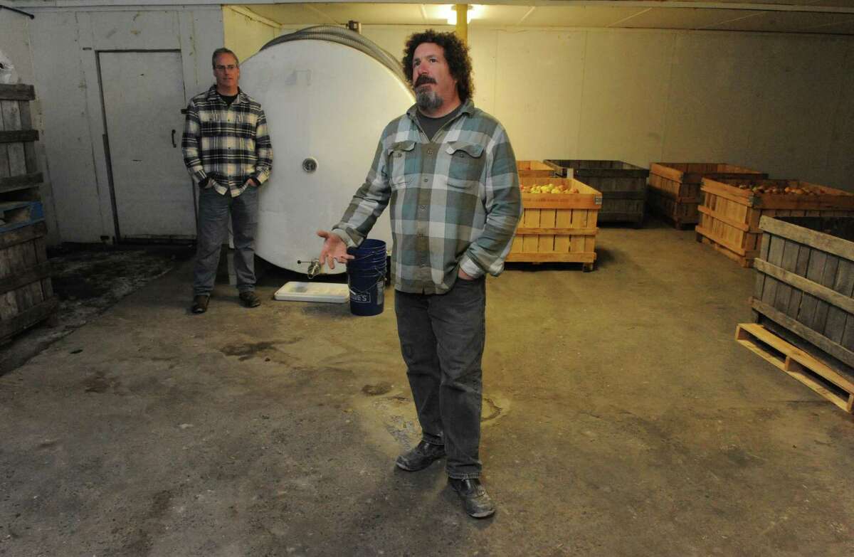 Owners Dietrich Gehring, center, and Stuart Morris of Indian Ladder Farmstead Cidery & Brewery on Thursday Feb. 5, 2016 in Altamont, N.Y. (Michael P. Farrell/Times Union)