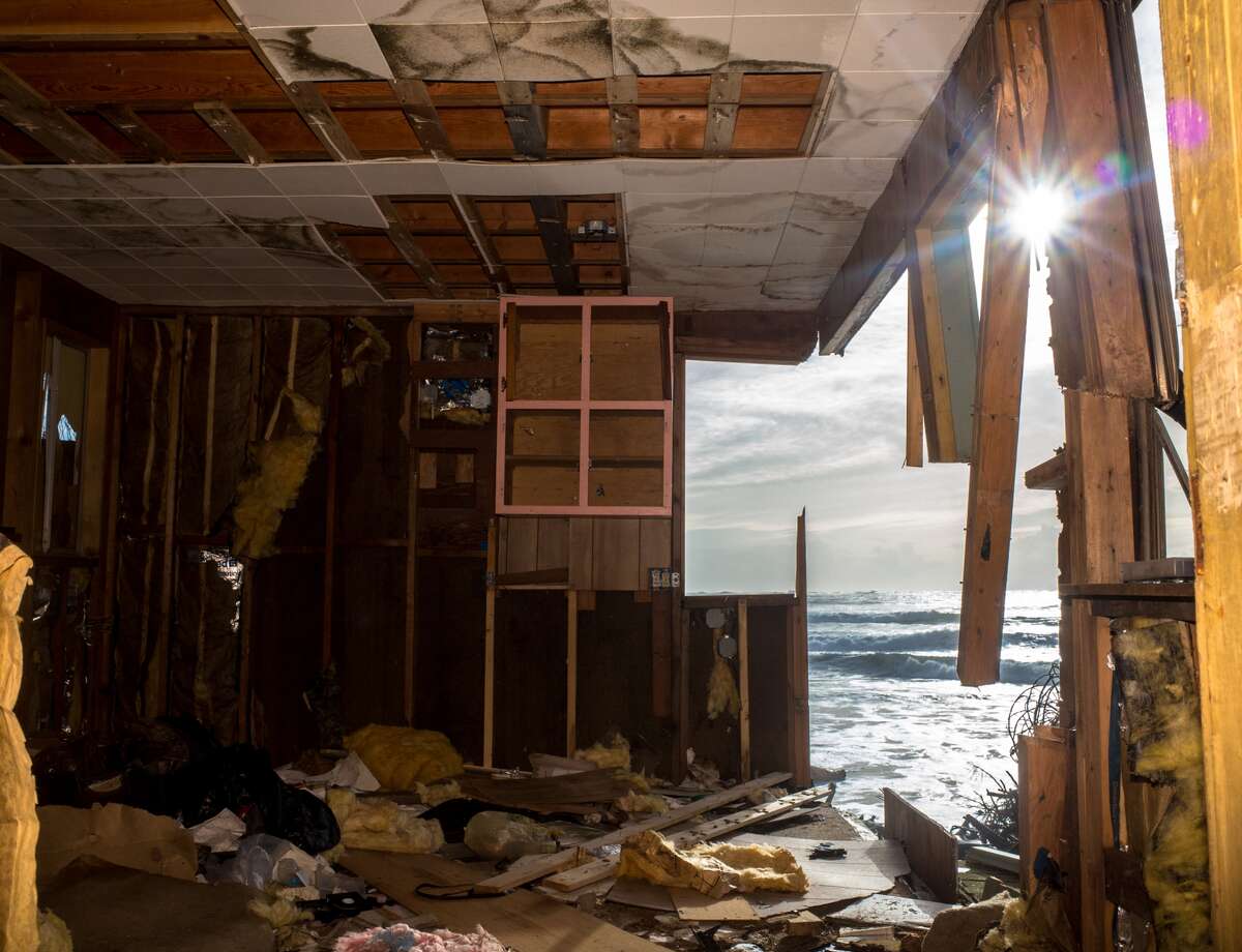 Once a charming little two story beach home is now a hallowed out mess at Washaway Beach.