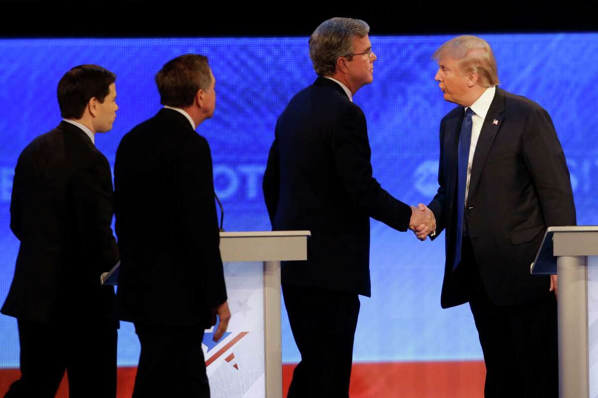 After hurling barbs at each other during the New Hampshire debate, Republican presidential candidates Jeb Bush (left) and Donald Trump shake hands. A reader expresses disdain for what she calls the bullying tactics of the businessman.