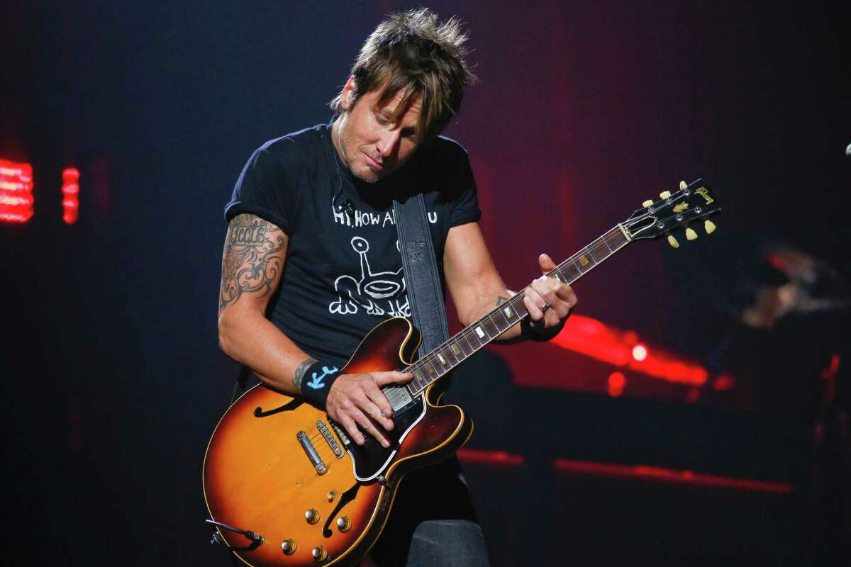 Keith Urban performs at the iTunes Festival during the SXSW Music Festival Saturday March 15, 2014, in Austin, Texas. (Photo by Jack Plunkett/Invision/AP)
