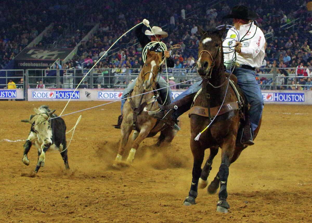 Charly Crawford and Shay Carroll pair up for the team roping, with Crawford as header and Carroll as heeler at the 2016 Houston Livestock Show and Rodeo.