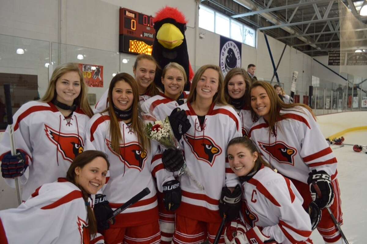 The Greenwich High School hockey team’s nine seniors gathered during the Cardinals’ Senior Day ceremony