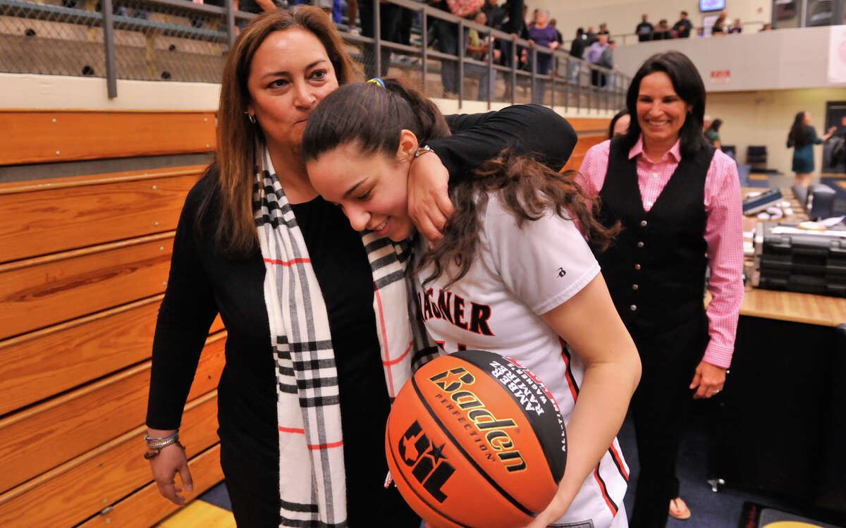 Wagner’s Amber Ramirez is hugged by Denise Forrestier after surpassing Forestier for third place on the area girls all-time scoring list on Feb. 15, 2016. Looking on is Wagner coach Christina Camacho