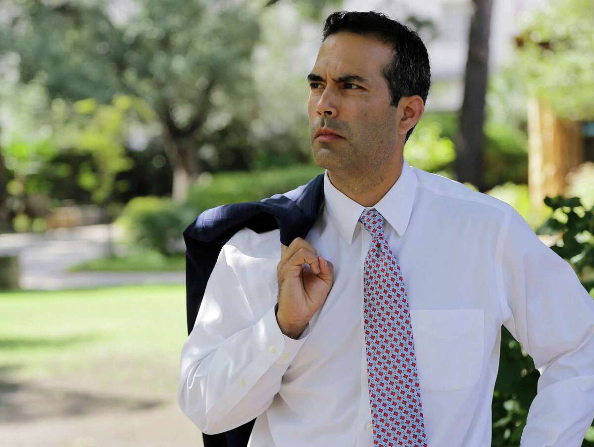 Texas Land Commissioner George P. Bush tours the grounds of the Alamo following a news conference in San Antonio.