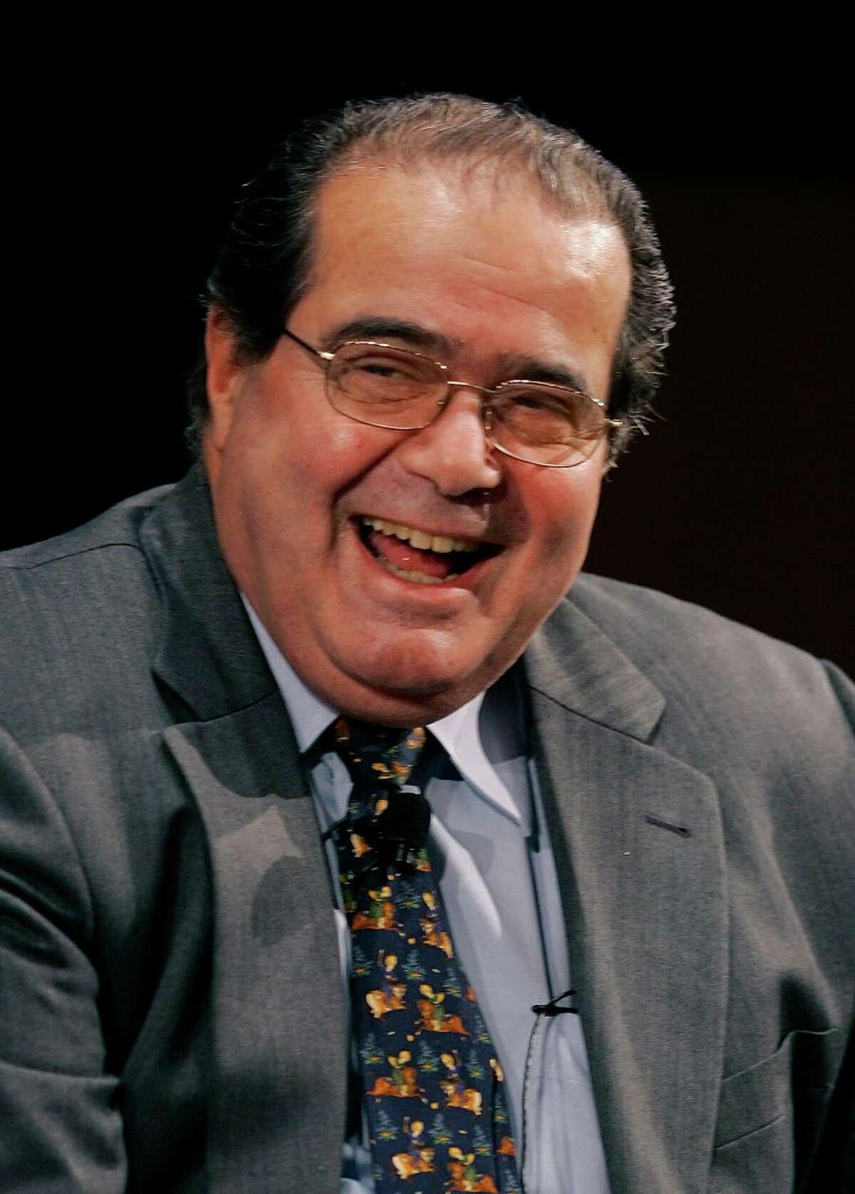 FILE - In this Wednesday, Jan. 10, 2007 file photo, Supreme Court Justice Antonin Scalia smiles during his introduction at the Intercontinental Hotel in Cleveland, as part of a Cleveland Clinic speakers series. On Saturday, Feb. 13, 2016, the U.S. Marshals Service confirmed that Scalia has died at the age of 79. (AP Photo/Mark Duncan) ORG XMIT: NYAS107