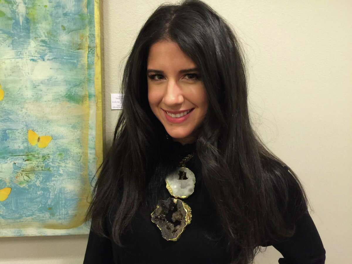 I seriously wanted to trip Alexandra Cavazos and steal everything she was wearing. Her amazing statement necklace ?‘ made from two geodes ?‘ gets to be the center of attention against a simple black silhouette, but she adds subtle detail with a fur collar under the necklaces and David Yurman bracelets on her wrists. Bravo!