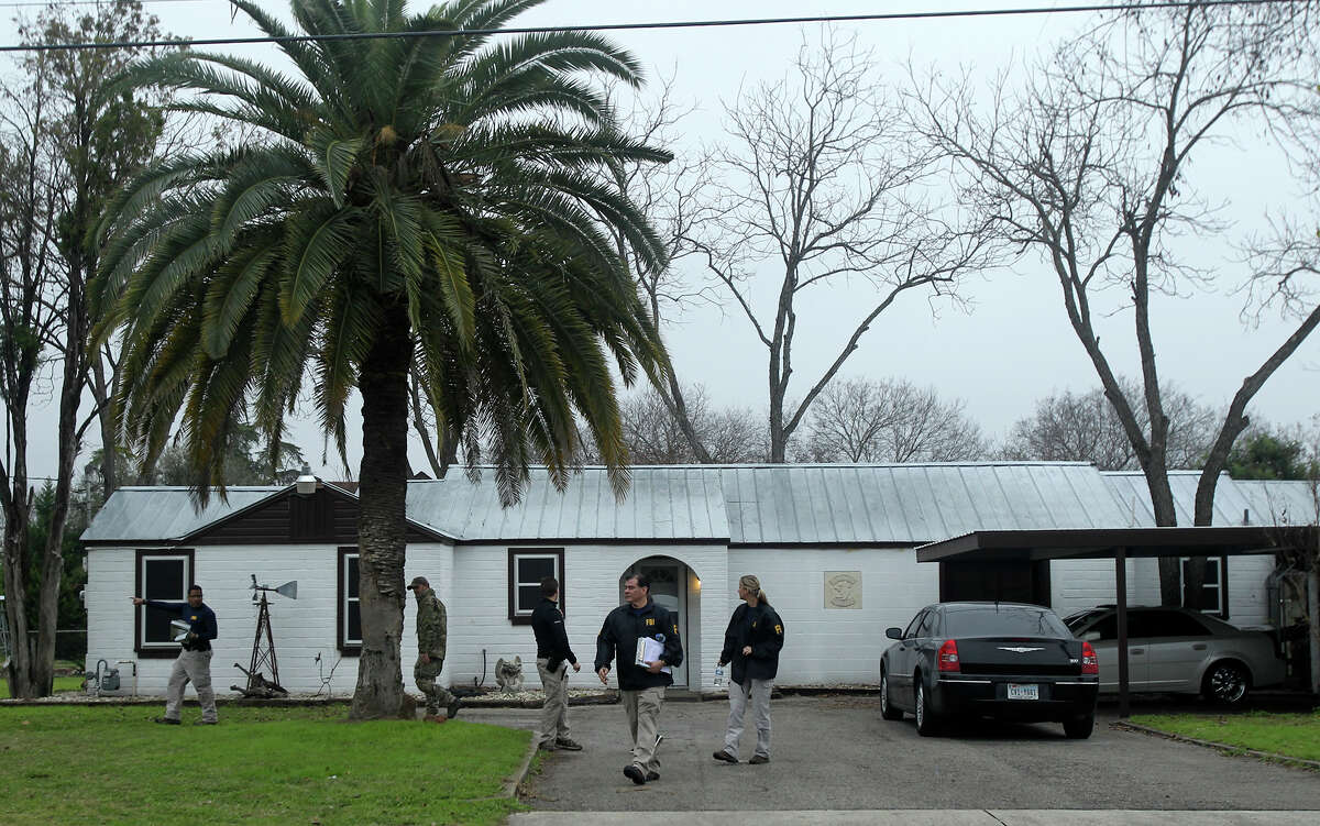 F.B.I. agents stand by a home located at 3003 Jupe Drive on San Antonio's South East Side where it is alleged that Bandidos Motocycle Club leader John X. Portillo lives. The agency said Portillo and the club's sergeant at arms, Justin Cole Forster, were taken into custody in San Antonio.