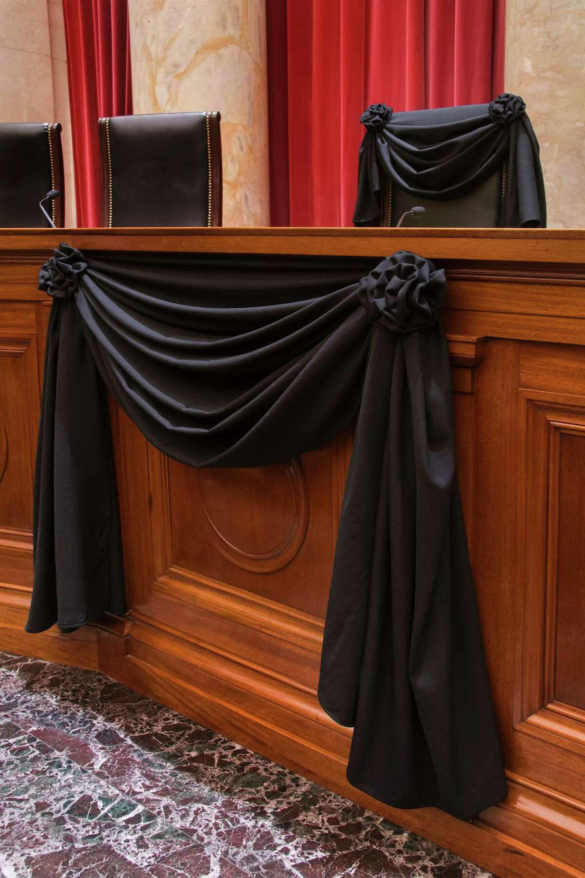 This photo obtained February 16, 2016 courtesy of the US Supreme Court shows Supreme Court Associate Justice Antonin Scalias Bench Chair and the Bench in front of his seat draped in black following his death on February 13, 2016. The sudden death of Justice Antonin Scalia, a towering conservative icon on the US Supreme Court, has set off an epic election-year battle over his successor that will shape American life far into the future.Scalia died of an apparent heart attack at age 79, leaving what had been a conservative-dominated court evenly divided in a year of blockbuster cases -- on abortion, affirmative action, immigration and President Barack Obama's health care law. / AFP / Supreme Court of the United States / Supreme Court of the United Stat / RESTRICTED TO EDITORIAL USE - MANDATORY CREDIT "AFP PHOTO / US SUPREME COURT" - NO MARKETING NO ADVERTISING CAMPAIGNS - DISTRIBUTED AS A SERVICE TO CLIENTS SUPREME COURT OF THE UNITED STAT/AFP/Getty Images