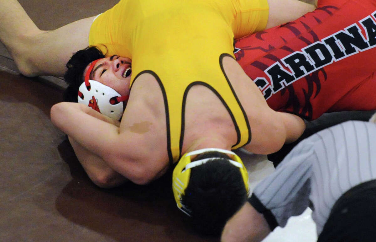 Sandro Mariana of Brunswick (yellow) during the match in which he defeated Pat Javier of Greenwich in the high school wrestling match between Brunswick School and Greenwich High School at Brunswick in Greenwich, Conn, Tuesday, Feb. 16, 2016. Brunswick defeated Greenwich, 45-25, to capture the town crown.