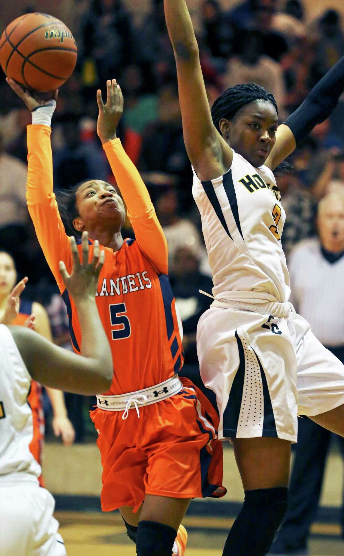 Gabby Connally goes inside for the Broncos to challenge Hornets forward Nalyssa Smith as East Central hosts Brandeis in 6A bi district girls basketball on February 16, 2016.