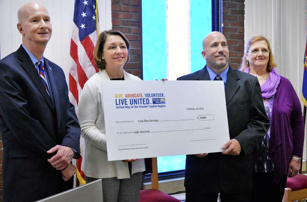 From left: United Way of the Greater Capital Region CEO Brian Hassett, left, Mayor Joanne Yepsen, Shelters of Saratoga's Mike Finocchi, and Code Blue Saratoga director Cheryl Ann Murphy-Parant with a ceremonial check from United Way during a news conference Tuesday Feb. 16, 2016 in Saratoga Springs, NY. (John Carl D'Annibale / Times Union)