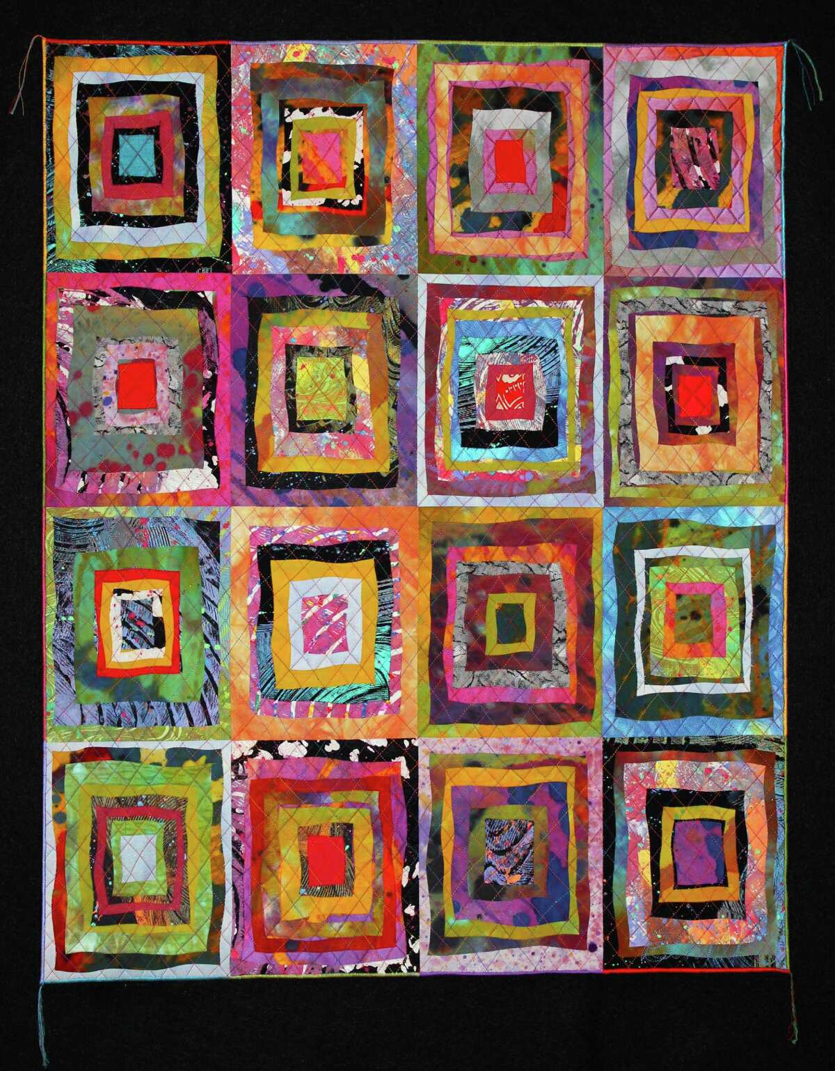 This quilt is part of the "Sue Benner: Circling the Square" exhibit on view April 2-June 28 at the Texas Quilt Museum in La Grange.