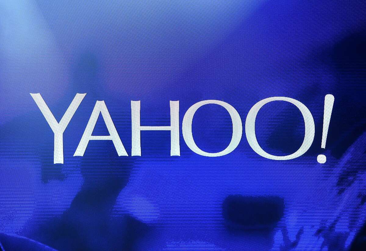 A Yahoo logo is shown on a screen during a keynote address by Yahoo CEO Marissa Mayer at the 2014 International CES at The Las Vegas Hotel & Casino in Las Vegas, Nevada. (Photo by Ethan Miller/Getty Images)