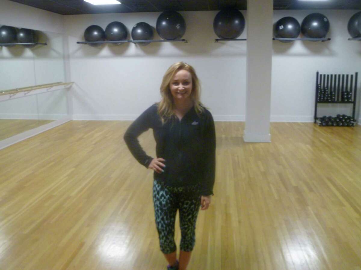 Suzanne Vining, who works at Halo Studios in New Canaan, at the 45 Grove St. fitness studio where she works. Vining and her family will appear on the Home and Garden TV channel’s “Property Brothers” show Wednesday, Feb. 24.