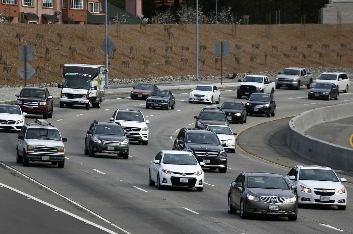 Drivers travel westbound on Highway 24 during their commute from Contra Costa County in Oakland, Calif. on Wednesday, Feb. 17, 2016. California lawmakers are considering an idea to eliminate state gas tax in favor of a tax based on miles driven annually.