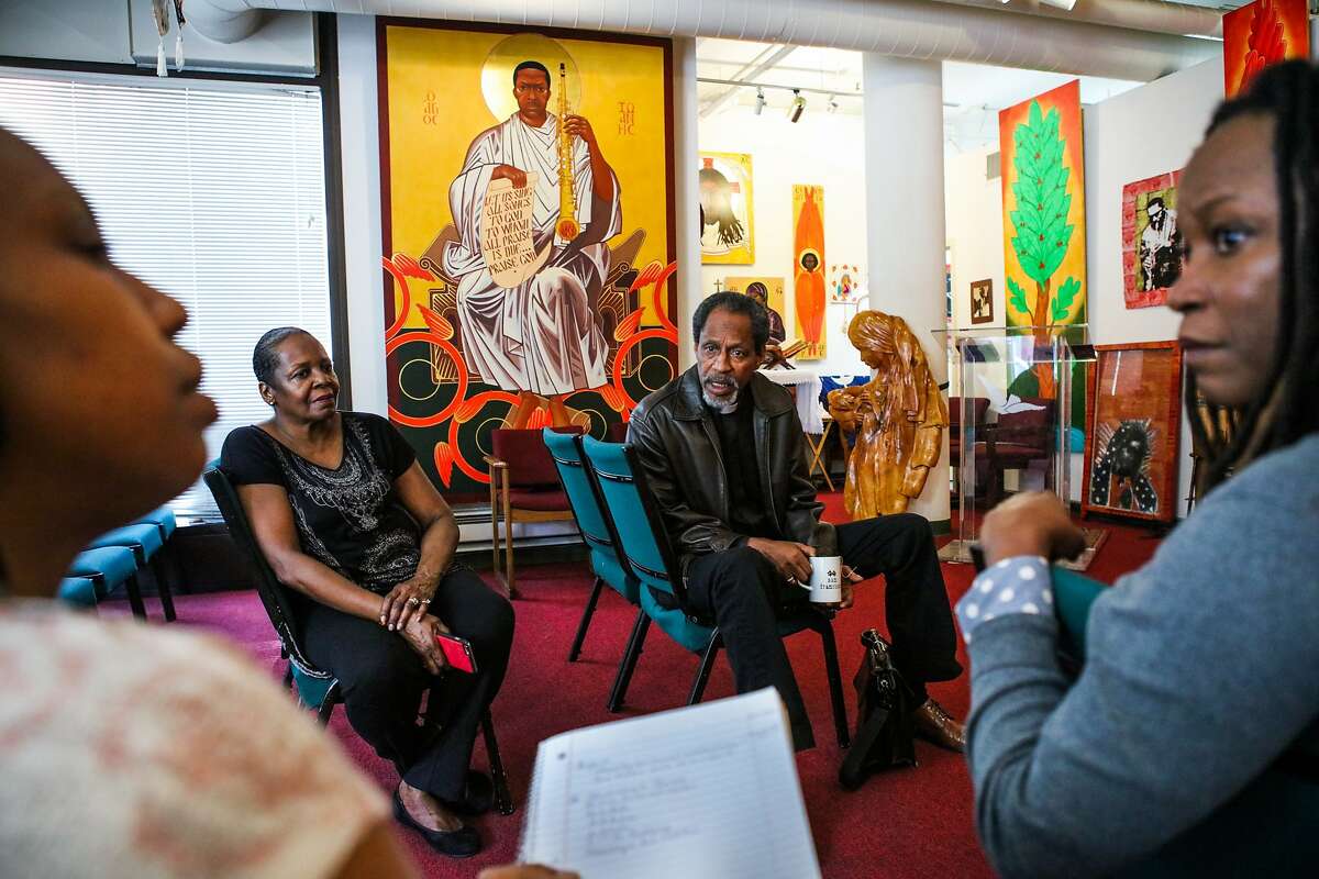 (l-r) Reverend Marlee-I Mystic, Supreme Mother Marina King, Reverend Archbishop Franzo W. King, and Reverend Wanika Stephens have a meeting in the chapel of the St. John Coltrane African Orthodox Church in San Francisco, California on Wednesday, February 17, 2016.
