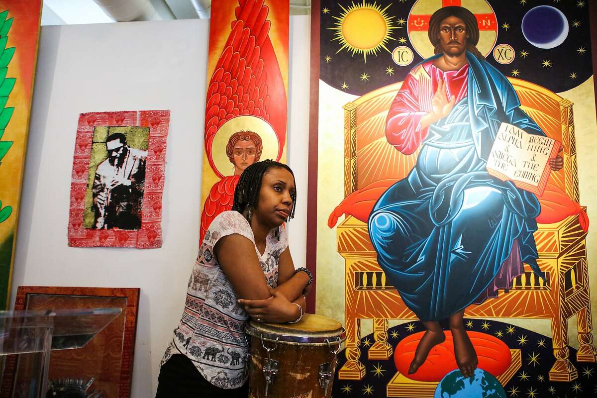 Reverend Marlee-I Mystic rests on the drums after a meeting with her colleagues at the St. John Coltrane African Orthodox Church in San Francisco, California on Wednesday, February 17, 2016.