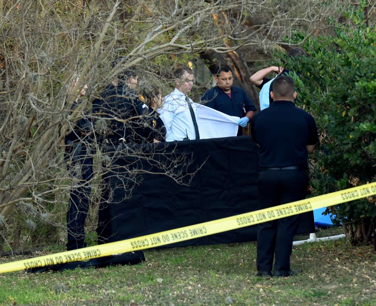 Police look over the scene in the 700 block of Isom where the body of a woman was found on Wednesday, Feb. 17, 2016. The woman had multiple stab wounds.
