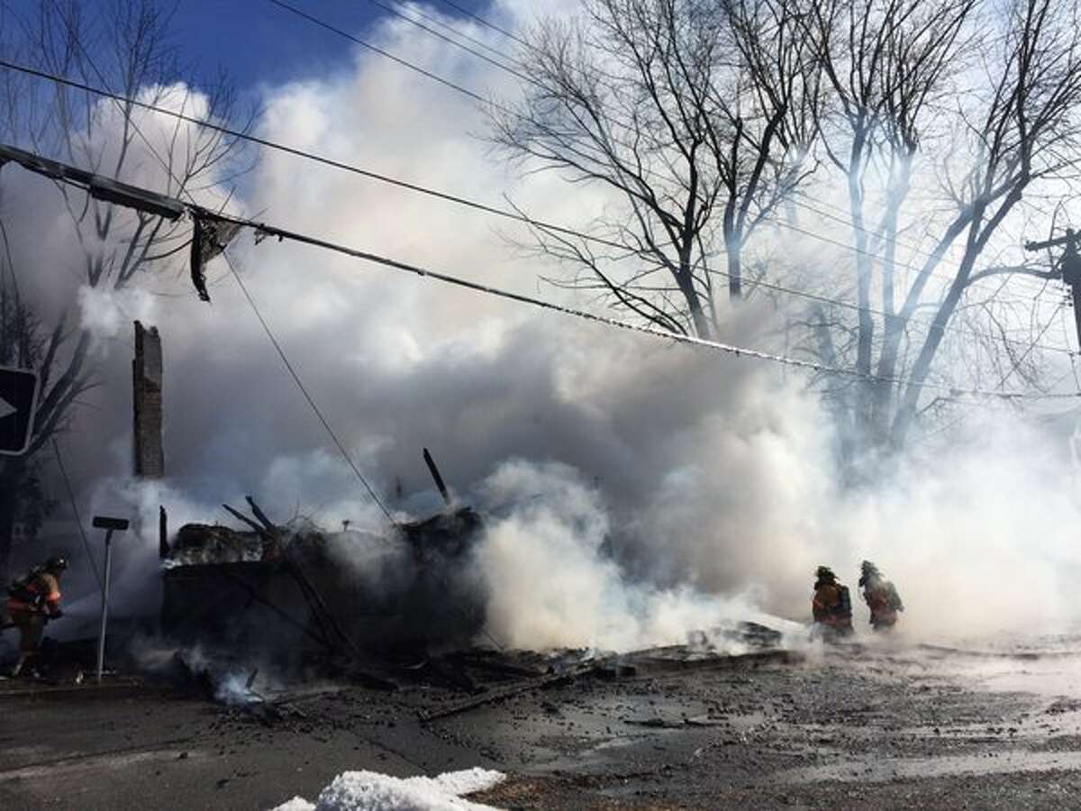 Firefighters hurt, pets killed, woman arrested in Castleton blaze