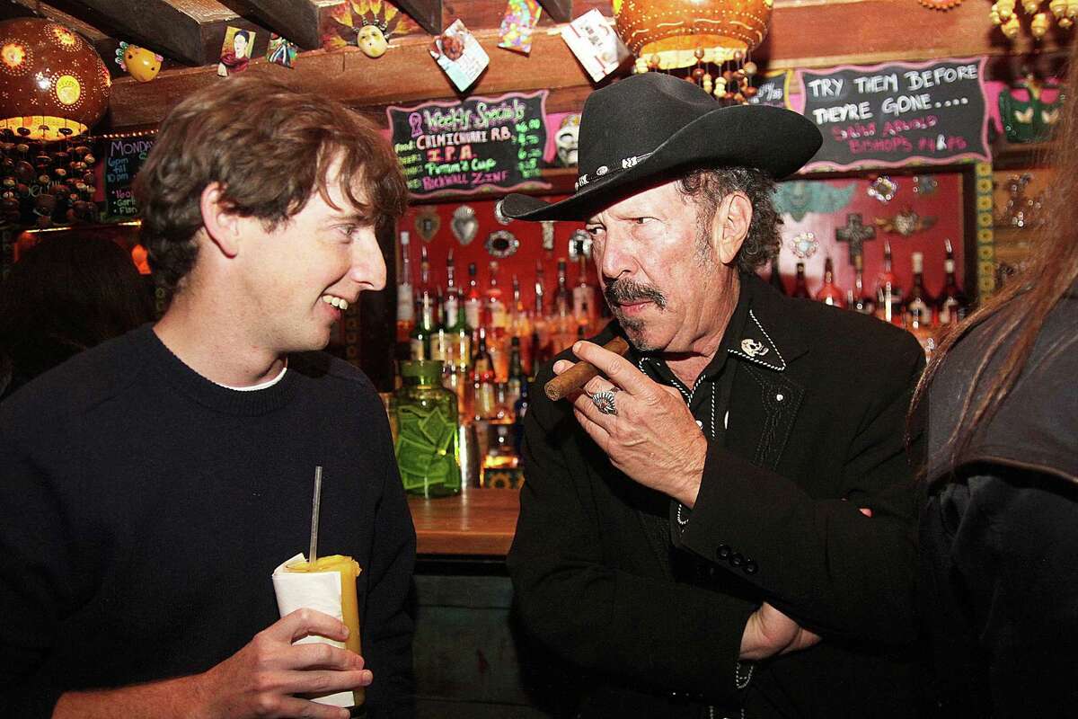 Kinky Friedman speaks to a young voter (Hudson Hansard) while Kevin Russell and the "Shinyribs" performed at Under the Volcano in 2016.