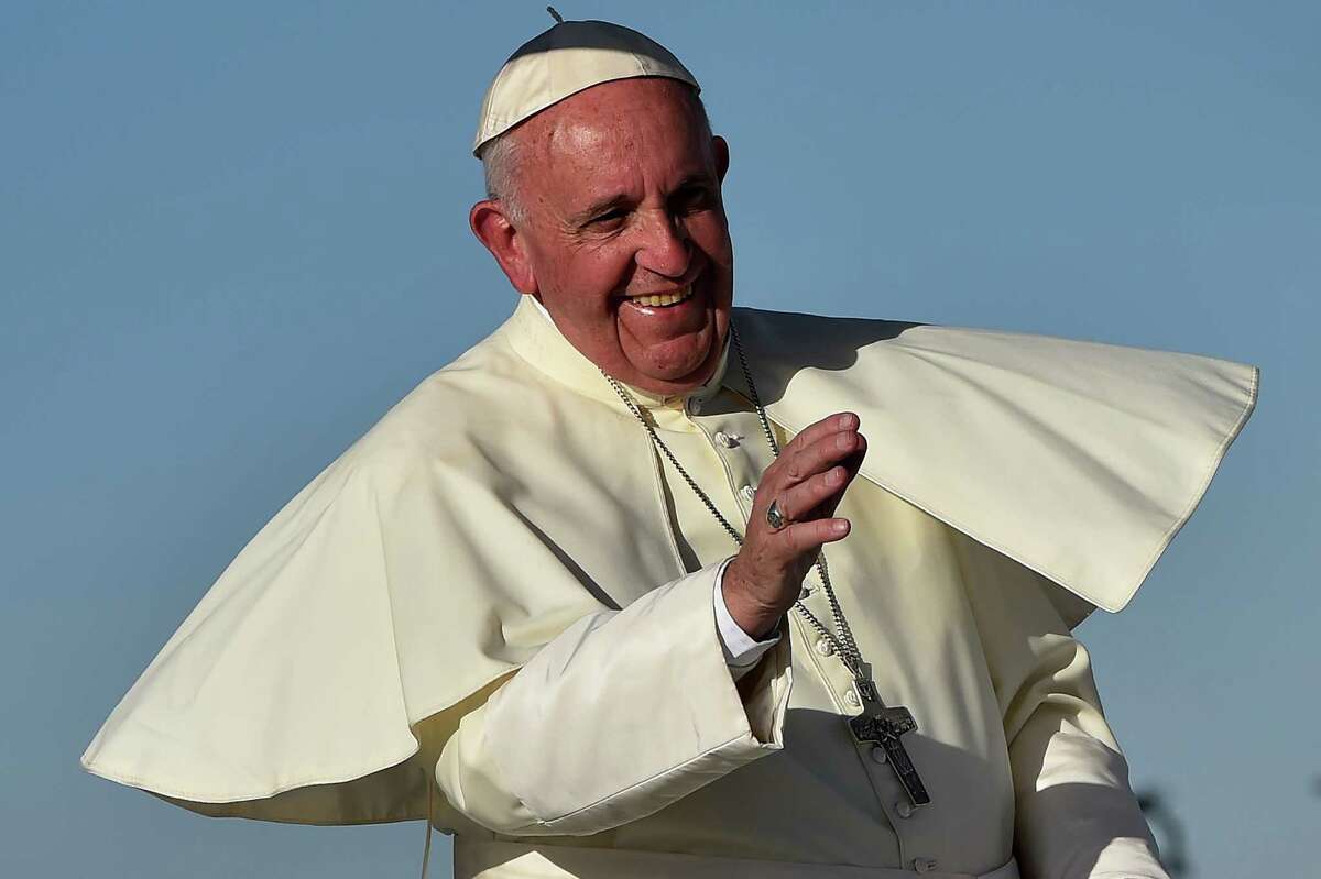Pope Francis smiles upon arrival at the US border, before celebrating mass at the Ciudad Juarez fairgrounds on February 17, 2016.