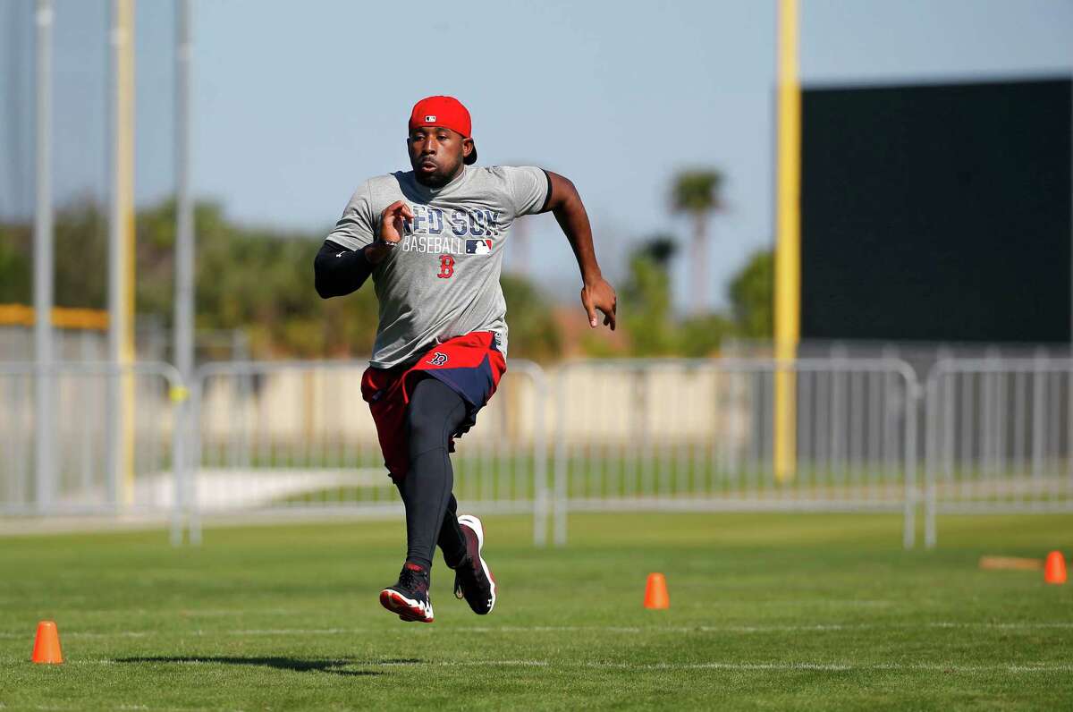 Boston Red Sox outfielder Jackie Bradley Jr. sprints during a spring training baseball practice in Fort Myers, Fla., Thursday, Feb. 18, 2016. Red Sox pitchers and catchers hold their first official workout on Friday. (AP Photo/Patrick Semansky) ORG XMIT: FLPS111