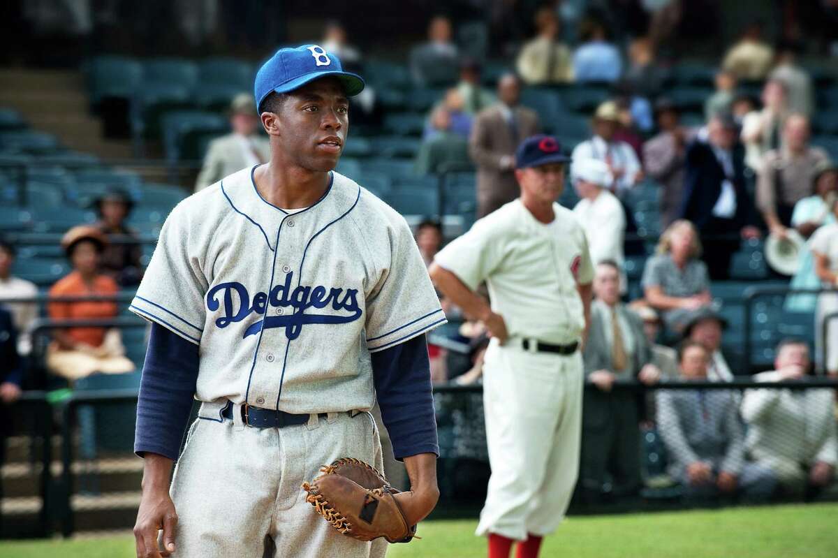 42 Year released: 2013 This biopic about baseball legend Jackie Robinson (played by Chadwick Boseman) chronicled his signing with the Brooklyn Dodgers and the watershed 1947 season in which he broke baseball's color barrier. The film doesn't sugarcoat the racism Robinson experienced, with a most uncomfortable scene in which Phillies manager Ben Chapman taunts him with a variety of racial epithets.