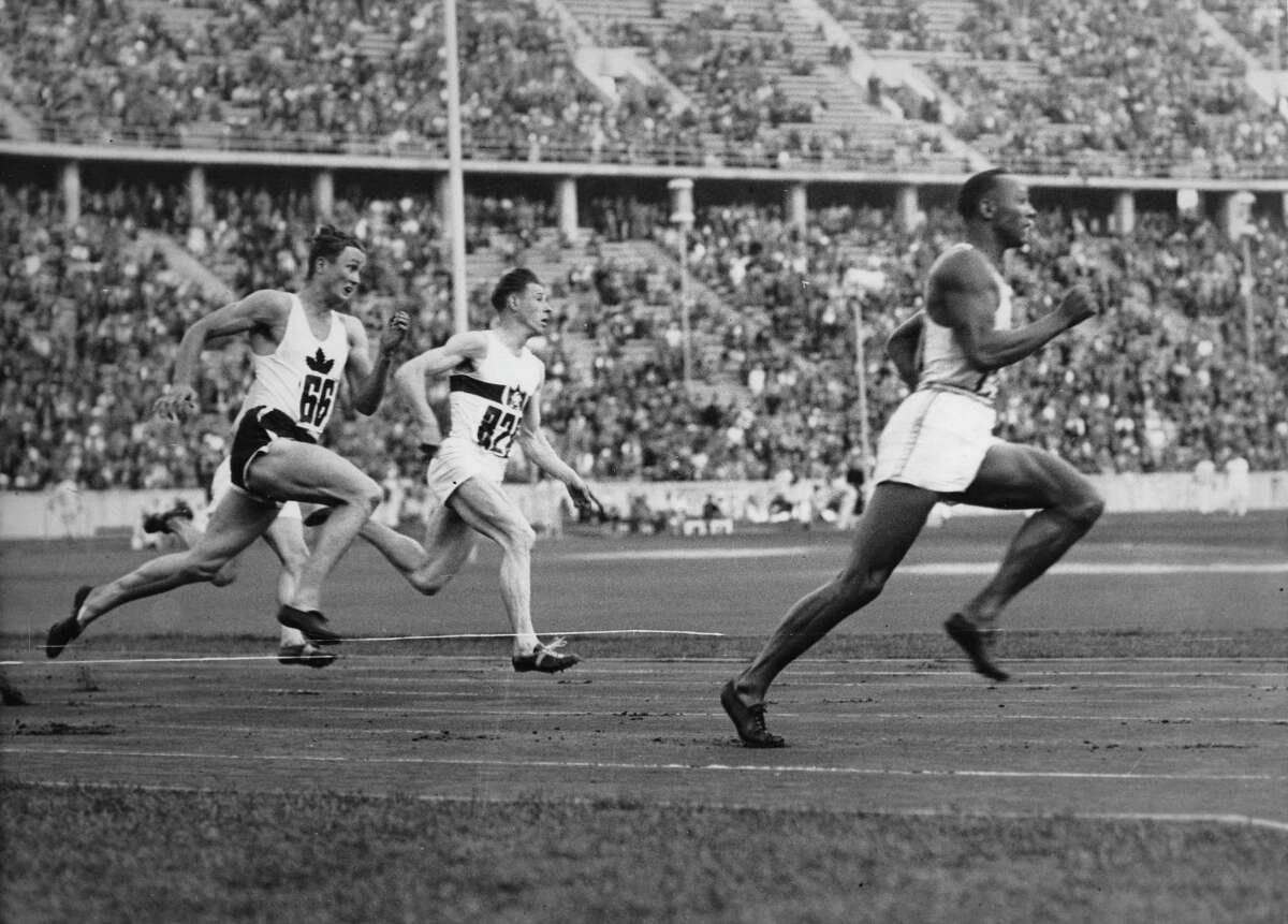Historic photos show Jesse Owens smashing world records at Hitler's