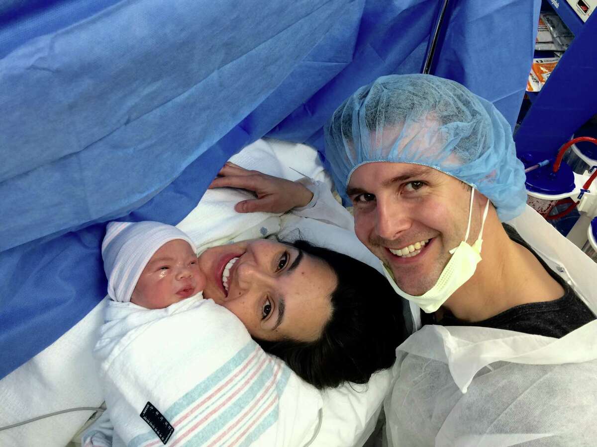 Isis Romero and Phil Anaya with their newborn son, Phillip.