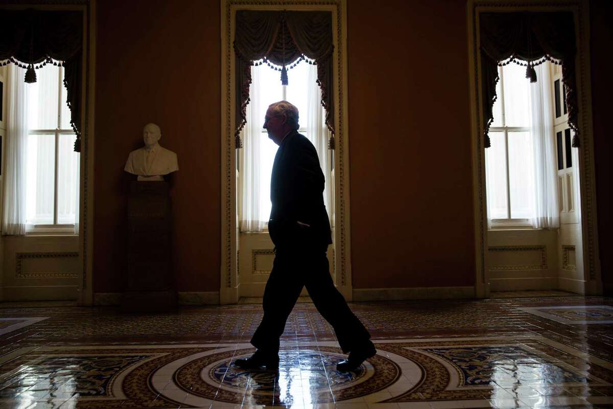 Senate Majority Leader Mitch McConnell walks to his office on Capitol Hill. A reader criticizes the Kentucky senator for saying the Senate will refuse to confirm any nominee President Obama makes to replace recently deceased Supreme Court Justice Antonin Scalia.