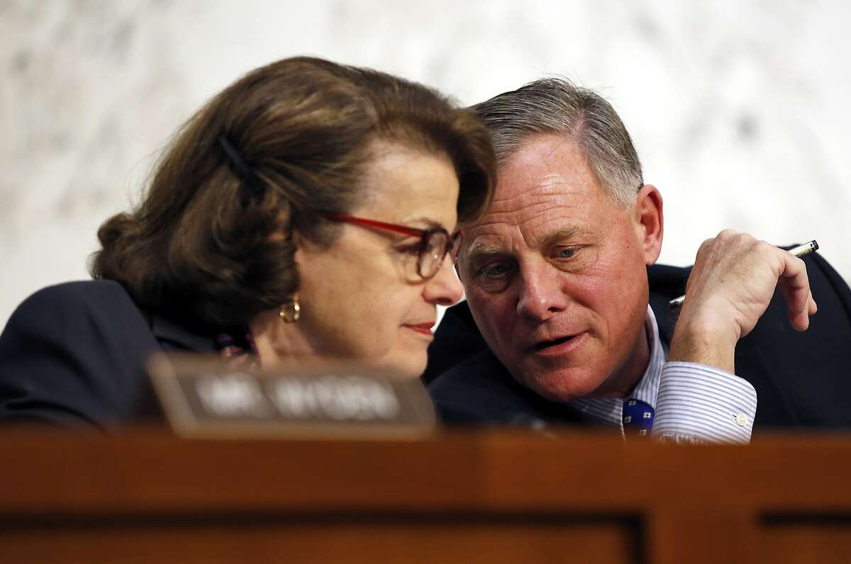 Vice Chairman Sen. Dianne Feinstein, D-Calif., left, and Chairman Sen. Richard Burr, R-N.C., talk during a hearing of the Senate Select Committee on Intelligence about worldwide threats, on Capitol Hill, Tuesday, Feb. 9, 2016 in Washington. 