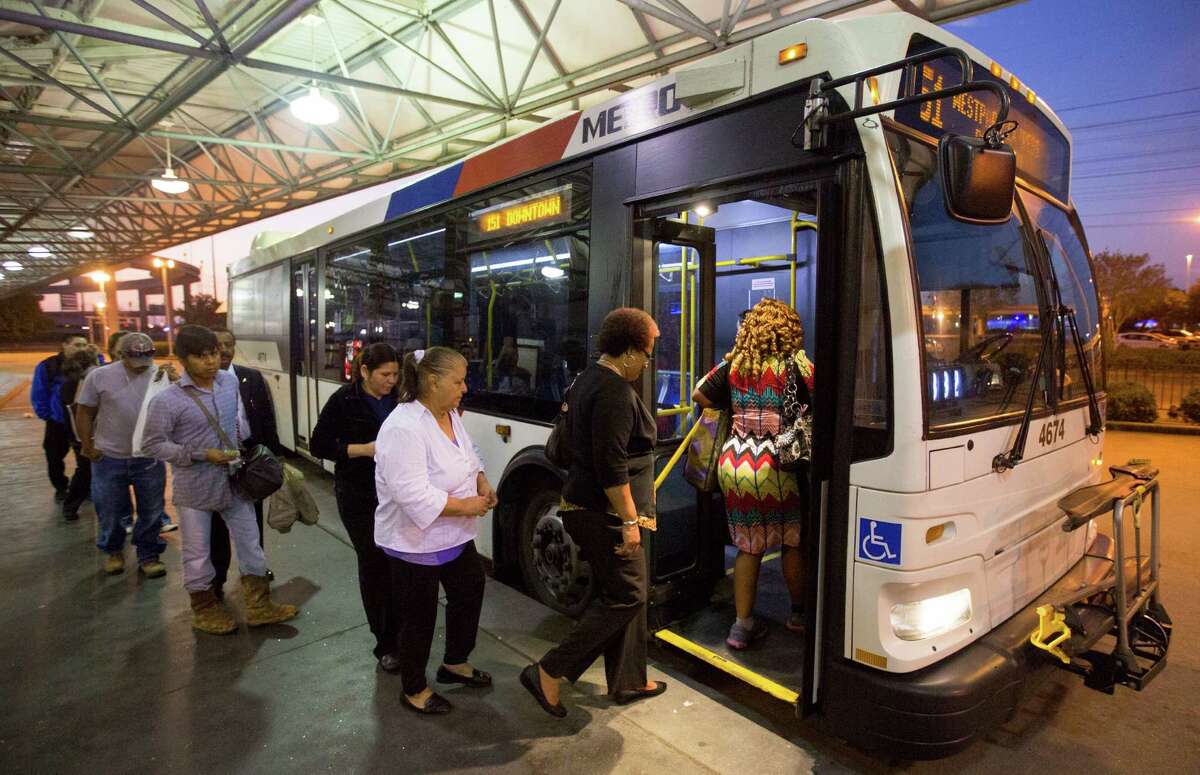 Riders board the 151 Westpark Express bus at the Hillcroft Park & Ride in Houston. (Cody Duty / Houston Chronicle)