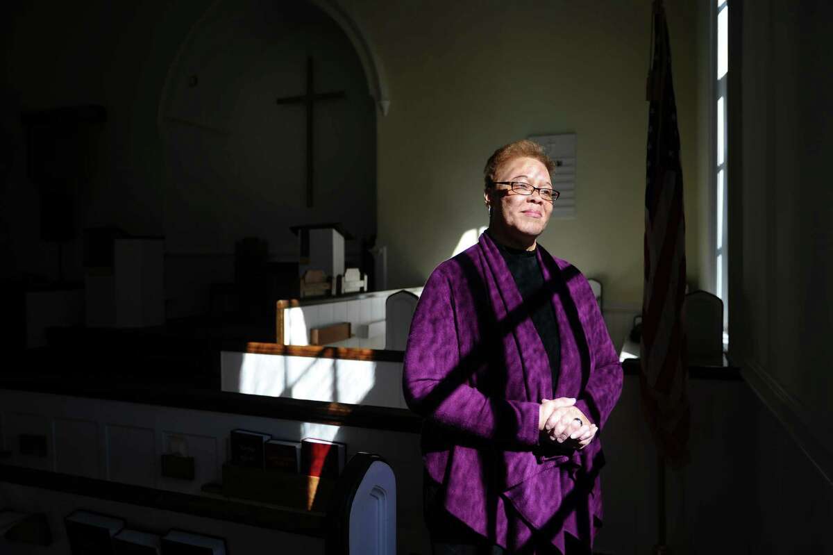 North Stamford Congretional Church Rev. Jacqueline Gilchrist poses for a photo inside her church on Thursday, Feb. 18, 2016. The church, which was founded in 1782, elected Rev. Gilchrist to lead them in October.