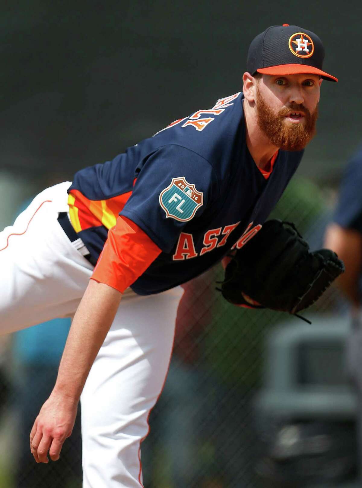 Houston Astros pitcher Dan Straily pitches during the first workout for Houston Astros pitchers and catchers for spring training in Kissimmee, Florida, Friday, Feb. 19, 2016.