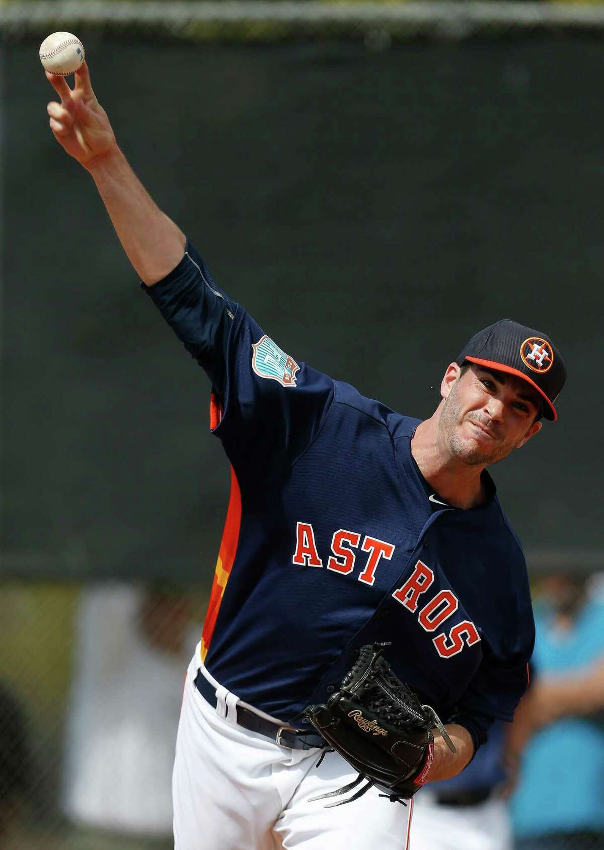 Houston Astros pitcher James Hoyt pitches during the first workout for Houston Astros pitchers and catchers for spring training in Kissimmee, Florida, Friday, Feb. 19, 2016.